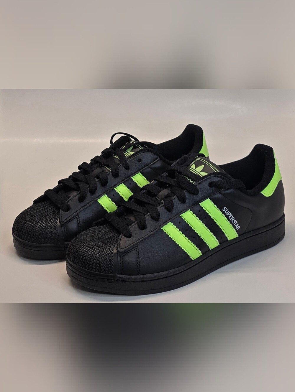 adidas Men’s Black Sneakers with Neon Green Stripes